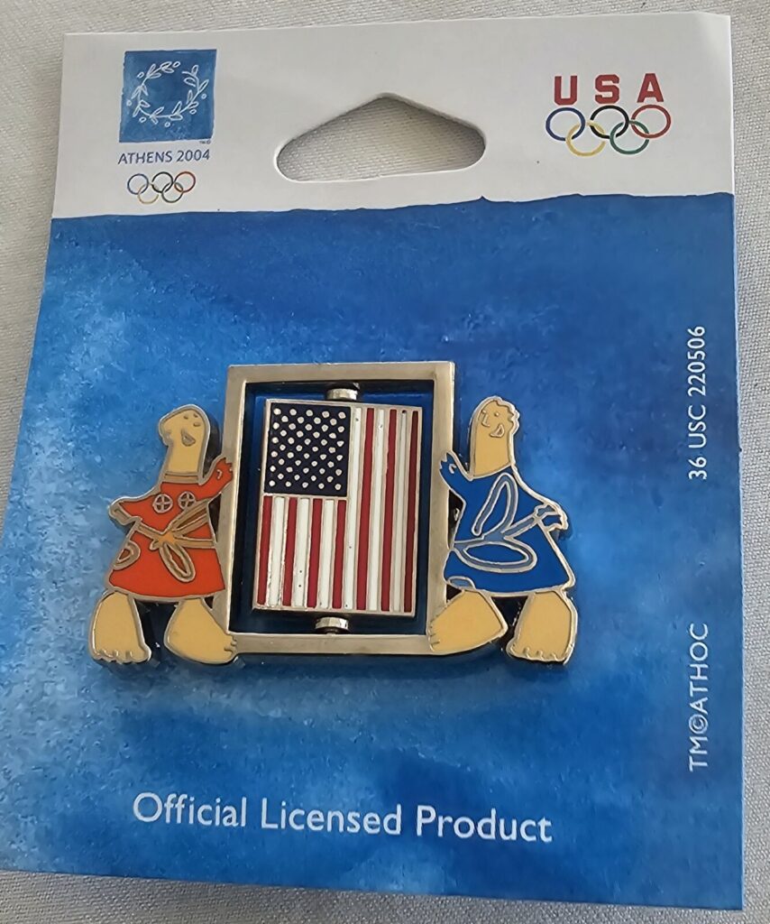 Official Licensed Olympic Games Pin Athens 2004 Mascots Spinning USA Flag Banner